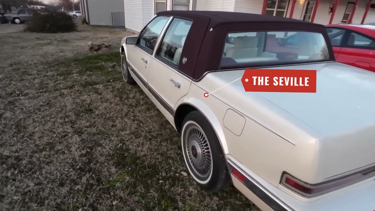 A white Cadillac Seville labelled by a ScenePilot graphic